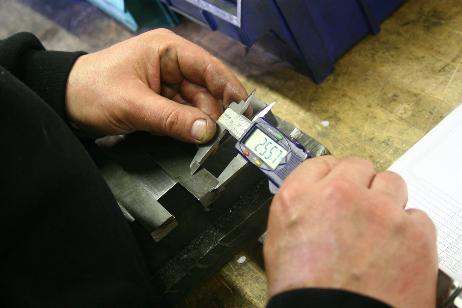 Dimensional inspection of metal parts at factory QC