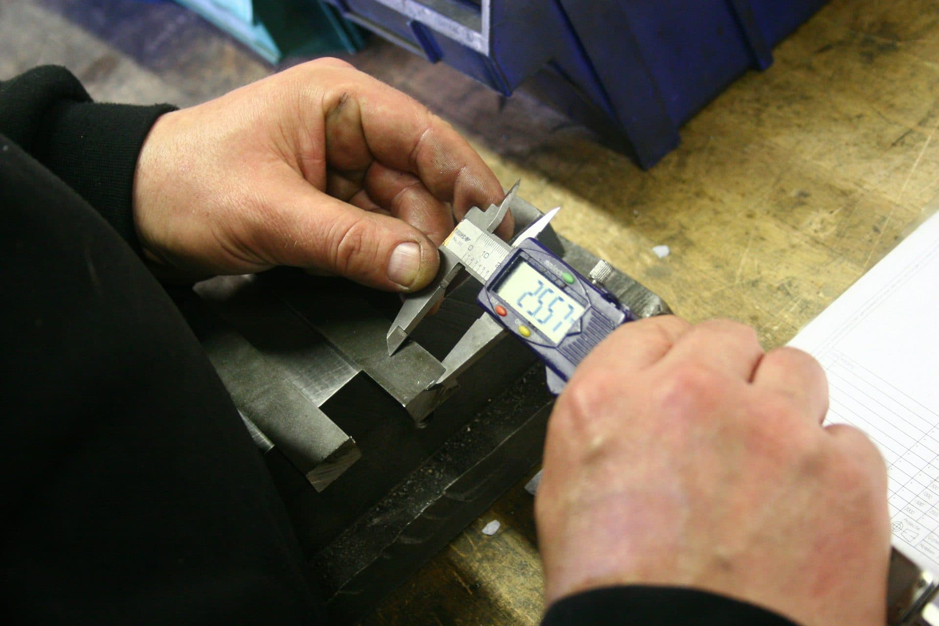Dimensional inspection of metal parts at factory QC
